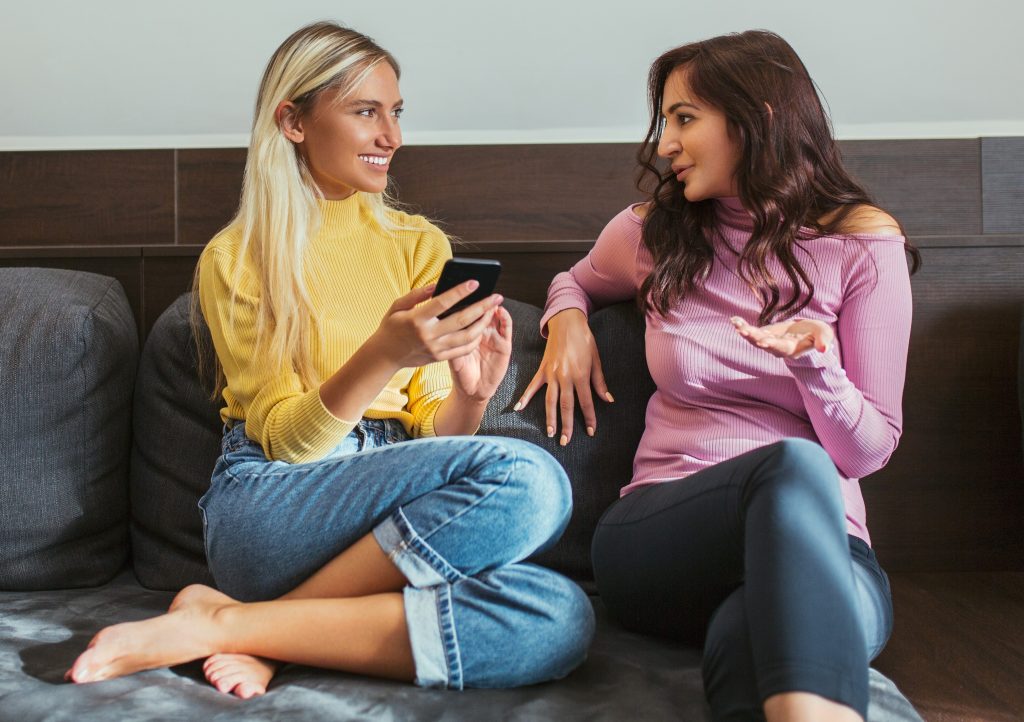 Female Friends on a Couch Talking